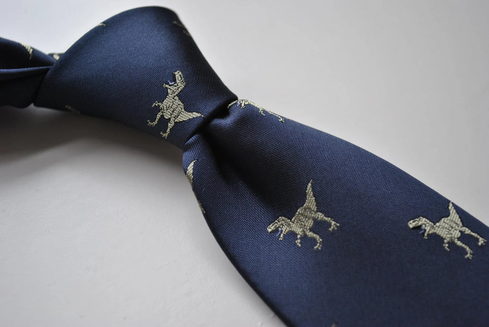 Navy blue tie embroidered with T-rex dinosaur