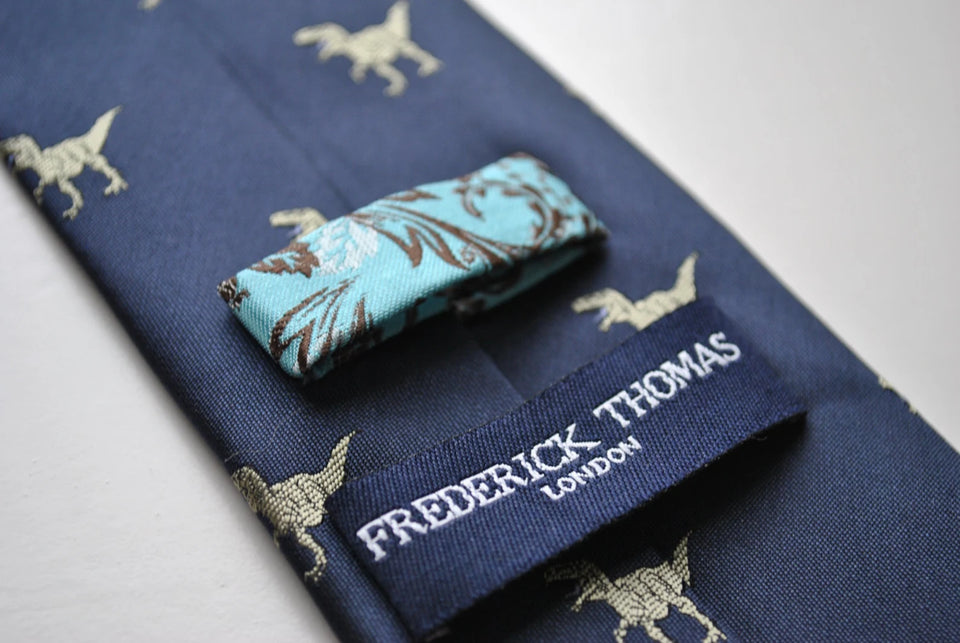 Navy blue tie embroidered with T-rex dinosaur