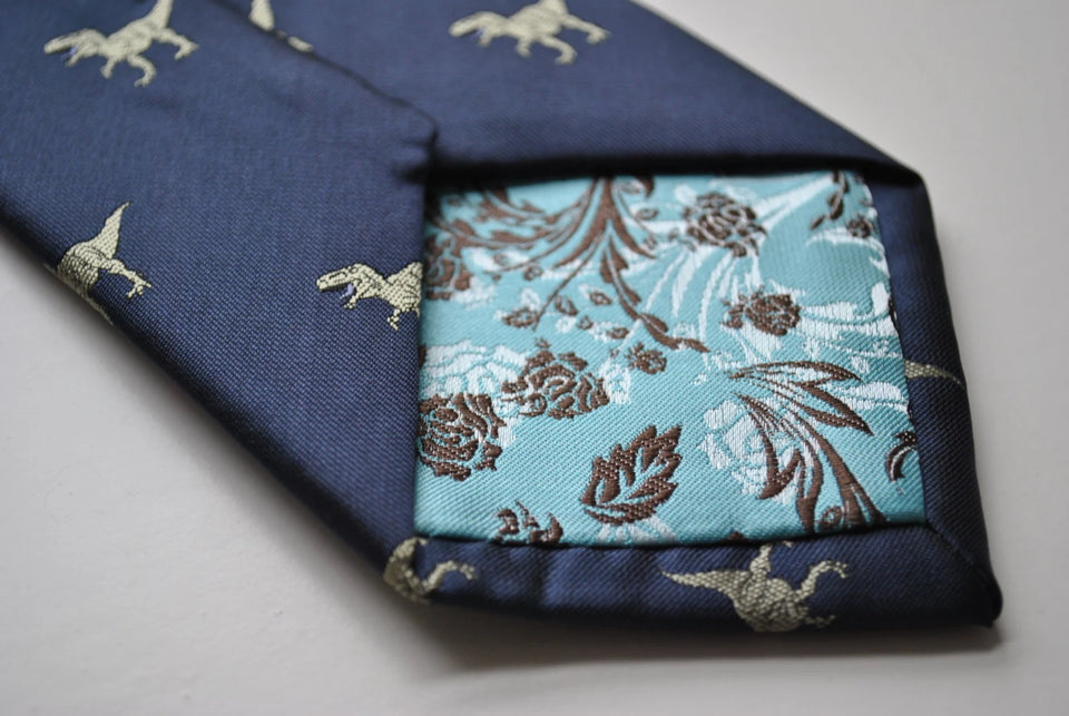 Navy blue tie embroidered with T-rex dinosaur
